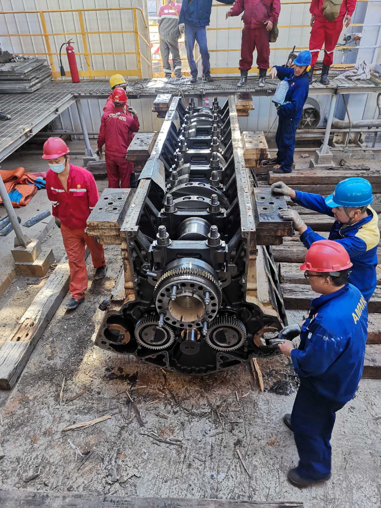 Team inspecting crankcase