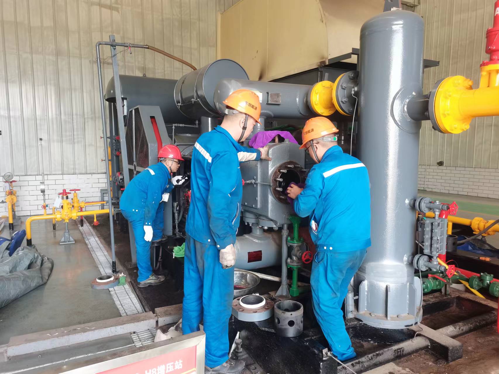 Three-person team performing DTY110 unit overhaul